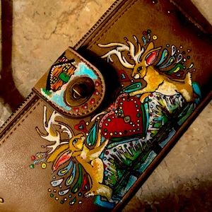 Beautiful hand painted vegan leather wallet.